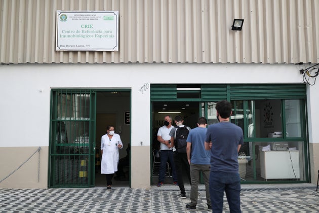 People stand in front of the Reference Center for Special Immunobiologicals (CRIE) of the Federal University...