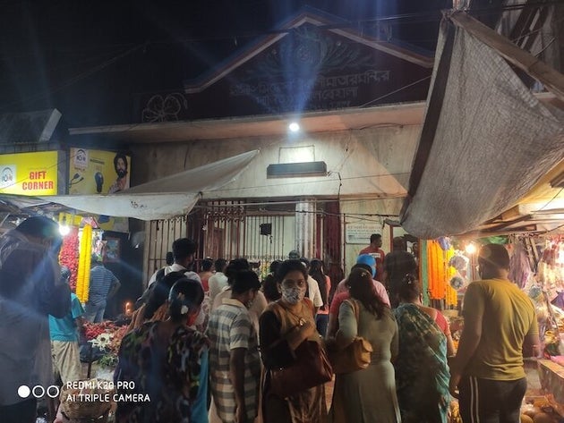 People gather near Siddheswari Kali Temple in Kolkata ahead of