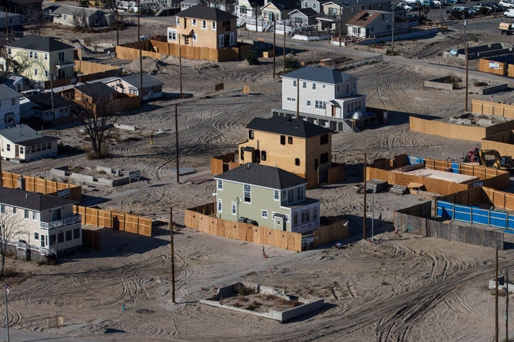 Homes sit under construction one year after being destroyed by Superstorm Sandy in the Breezy Point neighborhood of Queens, New York City.