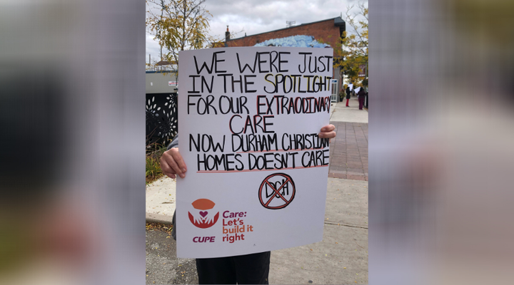 Workers laid off from Glen Hill Marnwood nursing home demonstrate in downtown Bowmanville, Ont. on Wednesday.