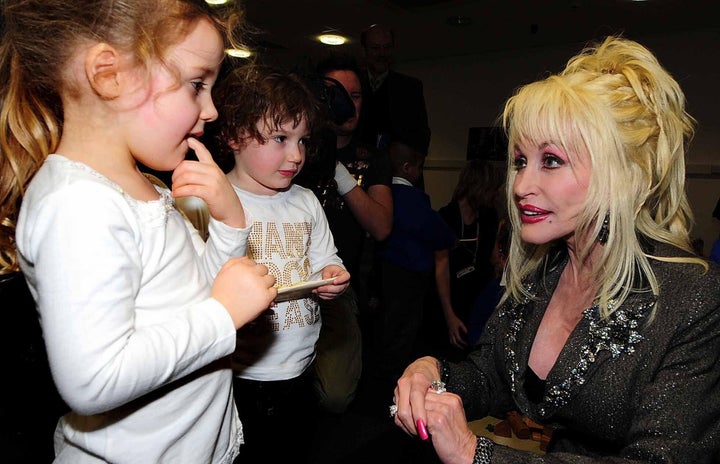 Dolly Parton meeting with kids as she launches the Imagination Library in Rotherham, South Yorkshire, U.K., in 2007.