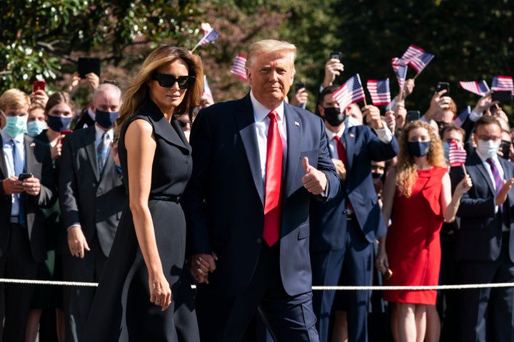 Donald Trump and first lady Melania Trump walk to board Marine One on the South Lawn of the White House, before heading to Nashville for Thursday's final presidential debate.