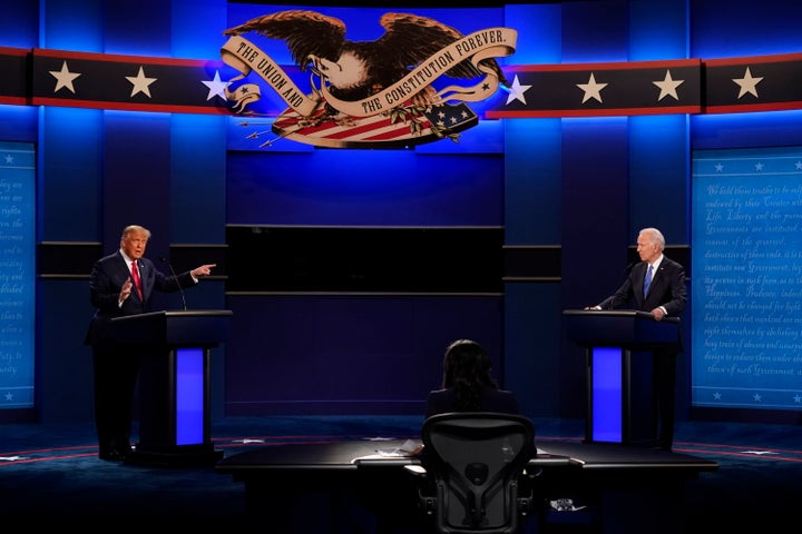 President Donald Trump points toward Democratic presidential candidate Joe Biden during the second and final presidential debate Thursday at Belmont University in Nashville.