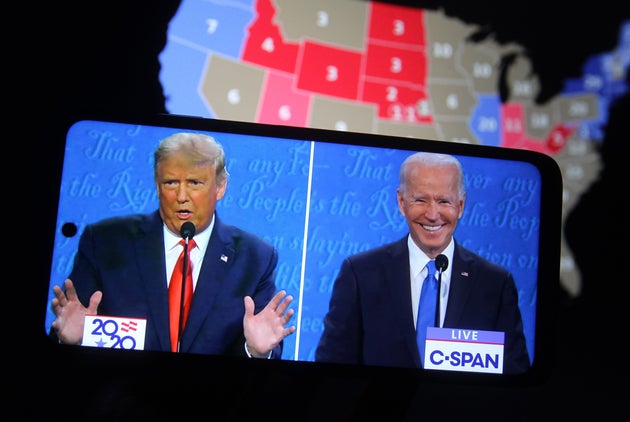 UKRAINE - 2020/10/23: In this photo illustration the US President Donald Trump and Democratic presidential candidate and former US Vice President Joe Biden are seen during the final presidential debate displayed on a screen of a smartphone.
The final presidential debate between President Donald Trump and former Vice President Joe Biden took place at Belmont University in Nashville, the U.S. on Thursday, October 22. United States presidential election scheduled for November 3, 2020. (Photo Illustration by Pavlo Conchar/SOPA Images/LightRocket via Getty Images)