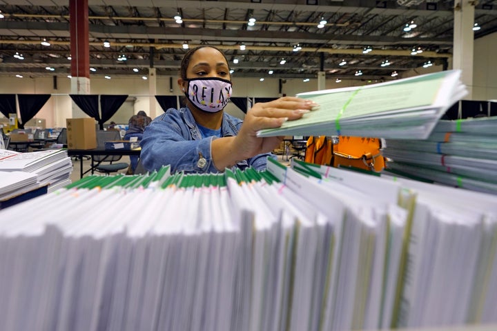 Harris County election worker Romanique Tillman prepares mail-in ballots to be sent out to voters Tuesday, Sept. 29, 2020, in Houston. (AP Photo/David J. Phillip)