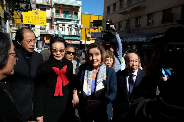 House Speaker Nancy Pelosi (D-Calif.), walks with Florence Fang, second from left, to a temple during a tour of Chinatown on Monday, Feb. 24, in San Francisco. Pelosi chatted with shop owners and took a walking tour of the local Chinatown in an effort to let people know the neighborhood is safe and would welcome their support.