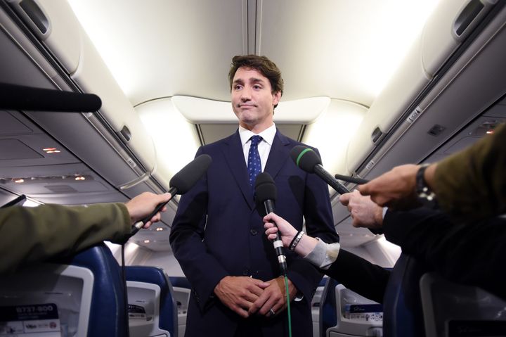 Justin Trudeau makes a statement in regards to photo of himself from 2001 wearing brownface, during a scrum on his campaign plane in Halifax, on Sept. 18, 2019.