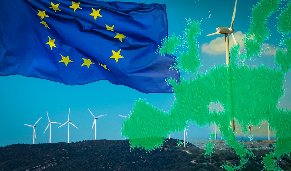 Wind turbines with EU flag and EU green map. Alternative energy sources in European Union. EU will revise the Renewable Energy Directive to ensure that the target of at least 27% renewable by 2030