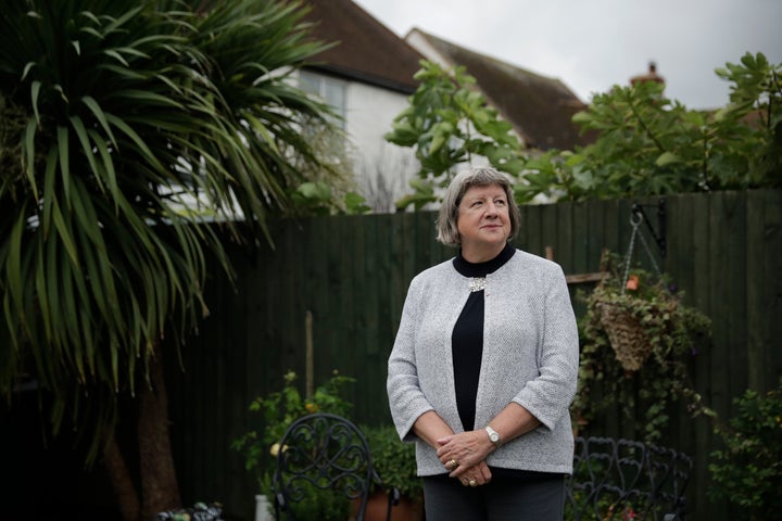 Mayflower descendant Vicky Cosstick poses for a portrait in the back garden of her home in the town of Seaford, on the south coast of England, Friday, Oct. 2, 2020. 