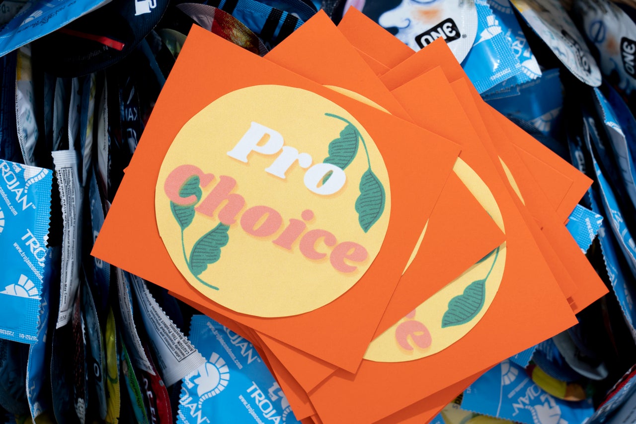 A pro-choice bumper sticker sits on a basket of condoms on campus at Saint Mary's College.