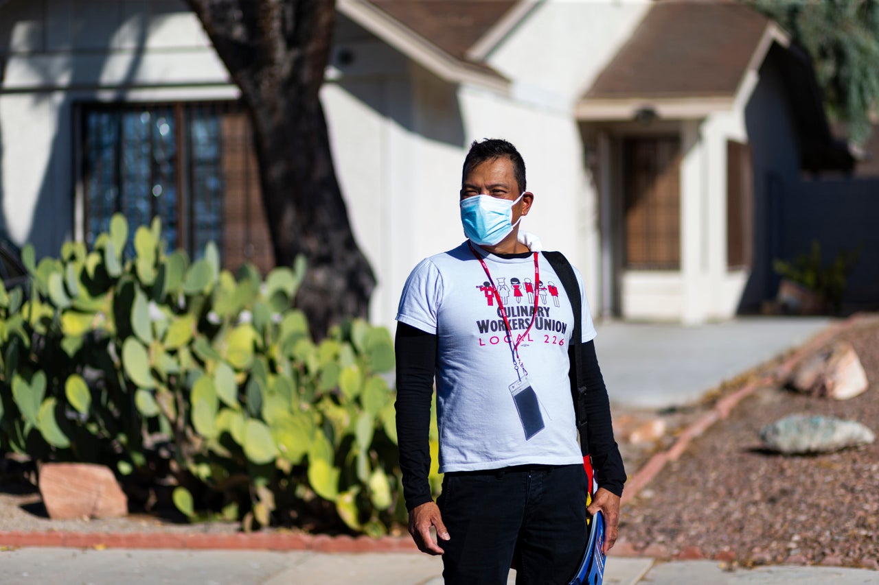 Meniano poses for a portrait while canvassing.