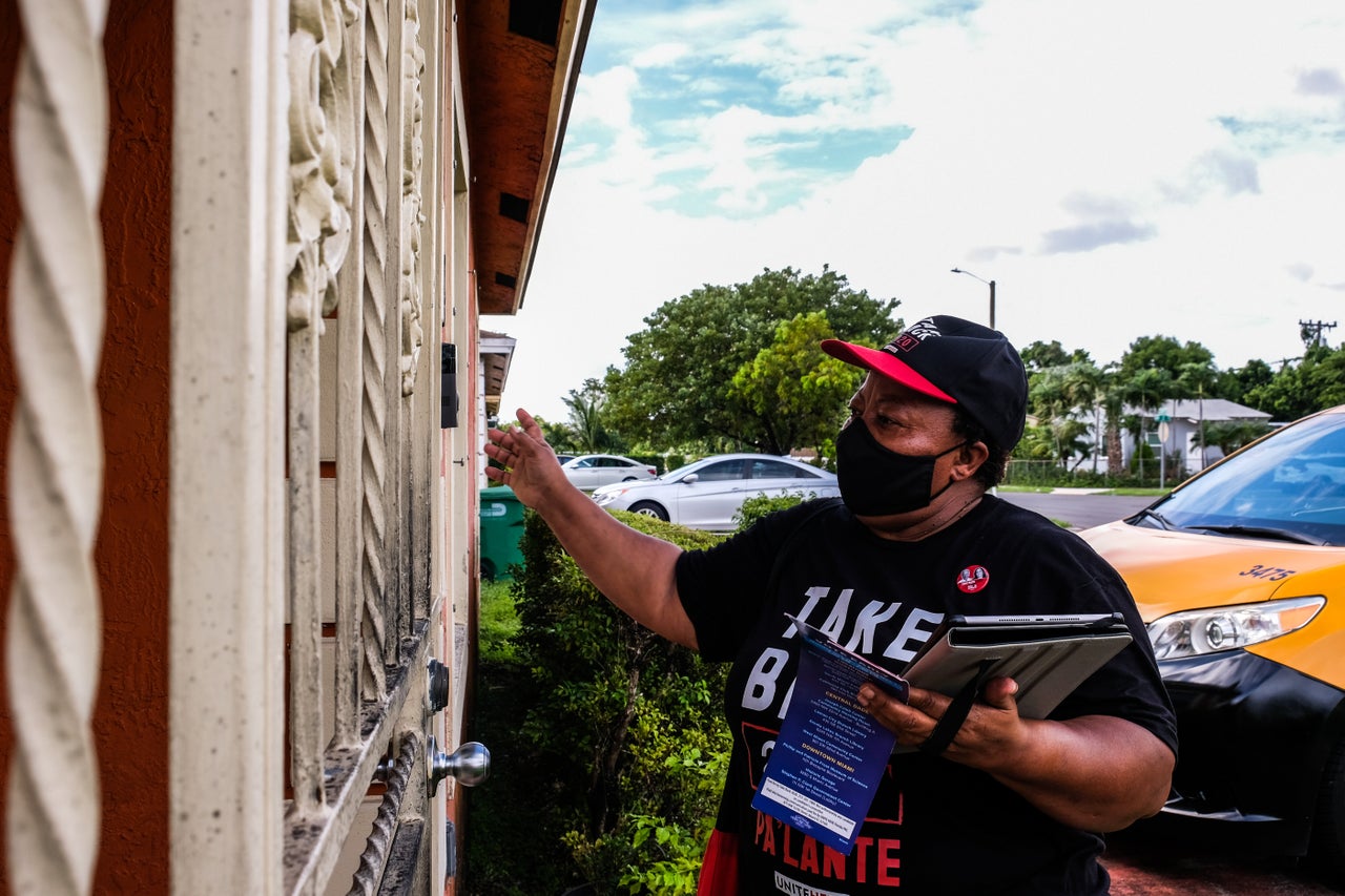 Yolette Lareus knocks on doors as part of a get-out-the-vote effort sponsored by her union.