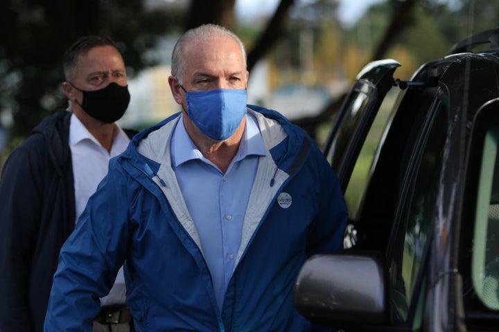 B.C. NDP Leader John Horgan leaves after voting in advance polls for the provincial election in Langford, B.C. on Oct. 19, 2020. 