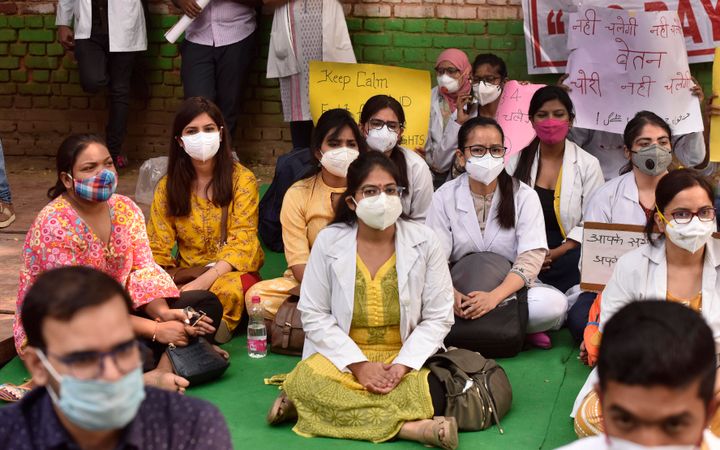 Hindu Roa and Kasturba Hospitals resident doctors sit in protest for their demand to release their wages on 22 October, 2020 in New Delhi.