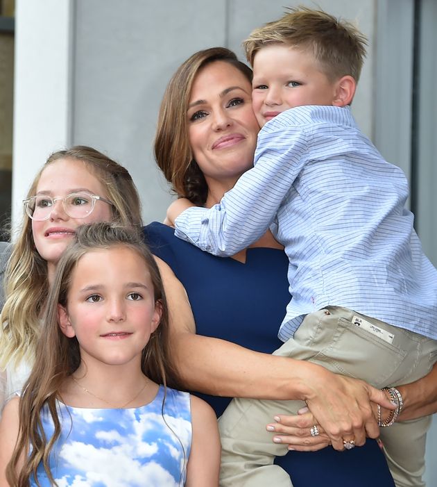 Jennifer Garner poses with her children Violet, Seraphina and Samuel at her star on the Hollywood Walk of Fame in 2018.