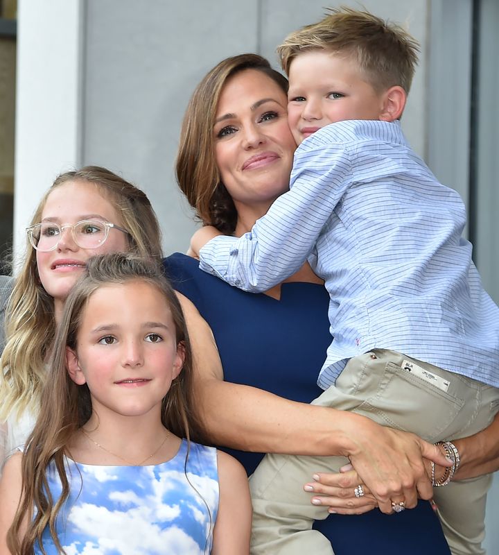 Jennifer Garner poses with her children Violet, Seraphina and Samuel at her star on the Hollywood Walk of Fame in 2018.