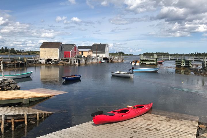 A red kayak is pictured on a dock in Blue Rocks, N.S., in August 2019. East Coast provinces have been bolstered by the ability to reopen the economy faster than the rest of the country.
