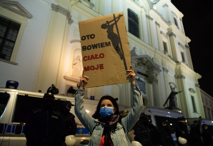 Polish Women Protest At Catholic Churches Over Country’s
Near-Total Abortion Ban 2 A protester holds a sign during a demonstration against tightening of abortion law in front of the Holy Cross church on Octob