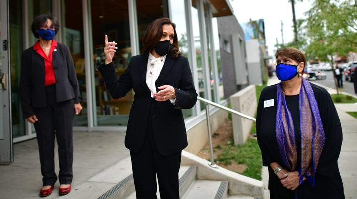Sen. Kamala Harris (D-Calif.), the Democratic vice presidential nominee, speaks to reporters before participating in a Latino