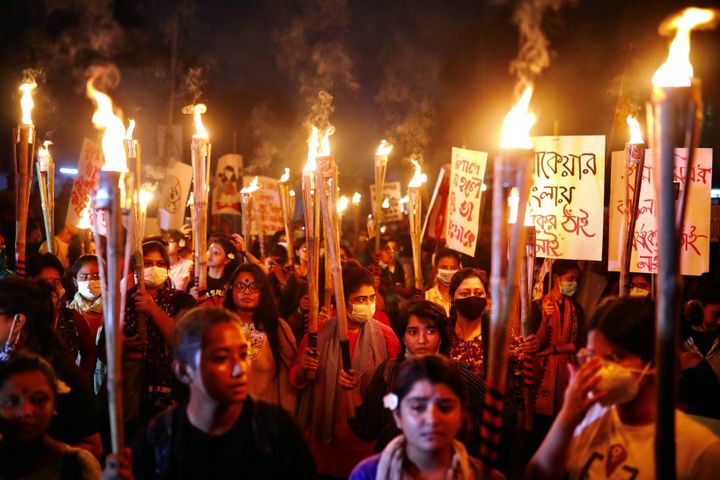 Women in Dhakha, Bangladesh, take part in a torch procession demanding women's safety and justice for rape victims on October 14, 2020. 