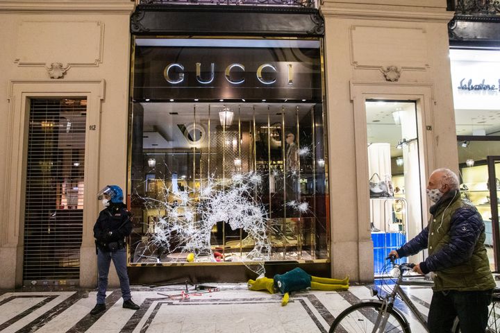 Damage and looting of downtown shops occurred after protesters clashed with riot police during a protest against the government-imposed blockade, in Turin, Italy, on Oct. 26, 2020. 