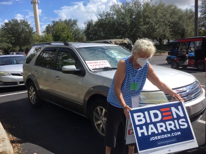 Carolee McReynolds, 77, staffs a lonely pro-Biden outpost at an early voting site in The Villages, long a Republican stronghold in central Florida.