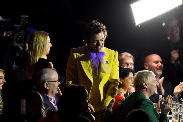 Harry wearing a "treat people with kindness" pin at the Brits