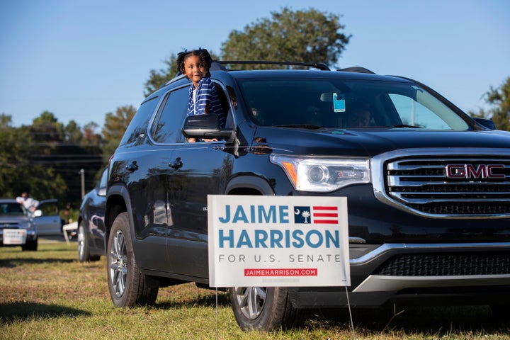 Braylen Washington waits for a drive-in campaign rally for Jaime Harrison to begin in North Charleston.