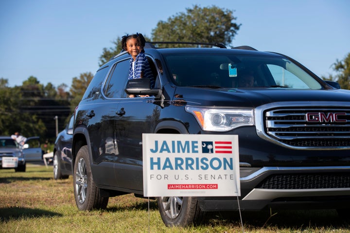 Braylen Washington waits for a drive-in campaign rally for Jaime Harrison to begin in North Charleston. 