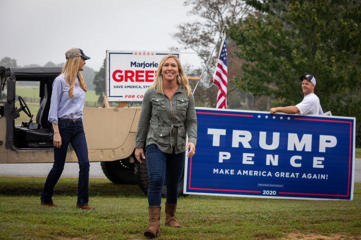 Georgia House candidate Marjorie Taylor Greene, center, has received mainstream Republican backing despite declaring belief in the QAnon conspiracy theory.