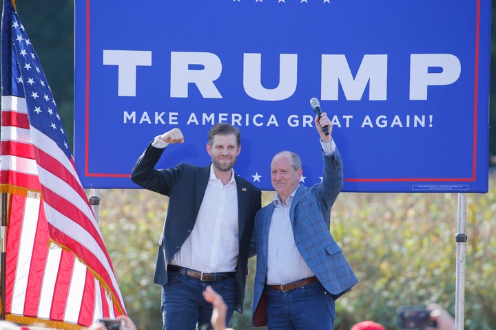 Eric Trump, left, the son of President Donald Trump, stands with Rep. Dan Bishop, R-N.C., at a campaign rally for Trump in Mo