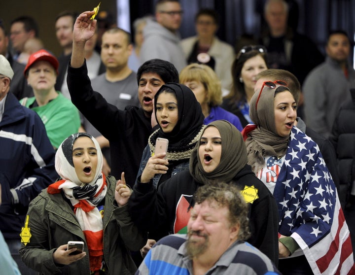 Young Muslims protest presidential candidate Donald Trump at a campaign rally in Wichita, Kansas, on March 5, 2016.