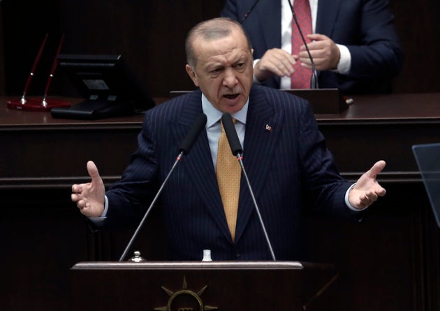 Turkey's President Recep Tayyip Erdogan addresses his ruling party lawmakers at the parliament, in Ankara,...