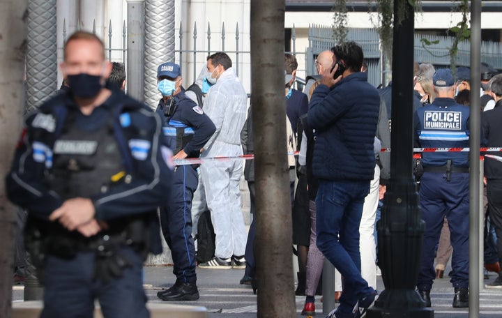 French forensics officers arrive at the site of a knife attack in Nice on October 29, 2020.