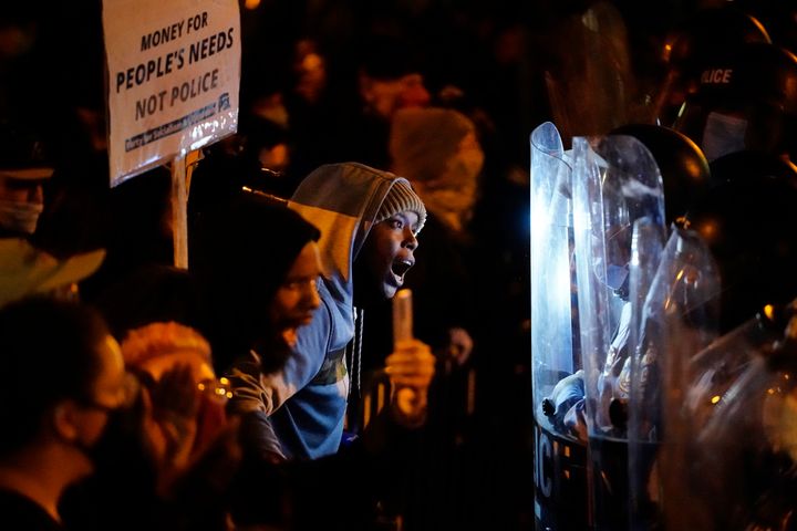 Protesters confront police during a march, Tuesday, Oct. 27, 2020, in Philadelphia. Hundreds of demonstrators marched in West Philadelphia over the death of Walter Wallace, a Black man who was killed by police in Philadelphia on Monday. (AP Photo/Matt Slocum)