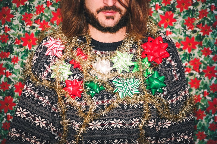 Man Wearing Ugly Holiday Sweater.