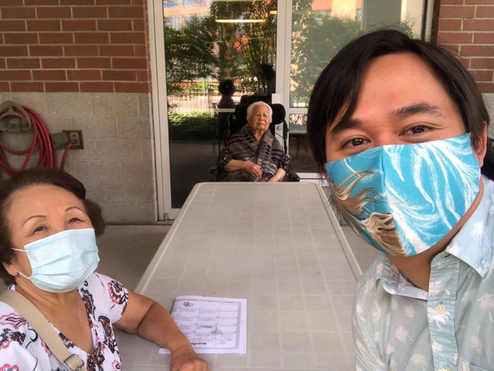 Jason Loo with his mom, during a visit to see his grandma at her long-term care home.