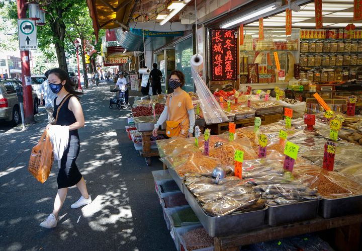 Customers shop during the COVID-19 pandemic in Chinatown of Vancouver, B.C., on July 20, 2020. 