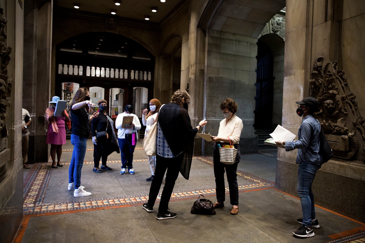 Voters wait to vote early in the 2020 election at a satellite voting location at City Hall in Philadelphia on Sept. 29.