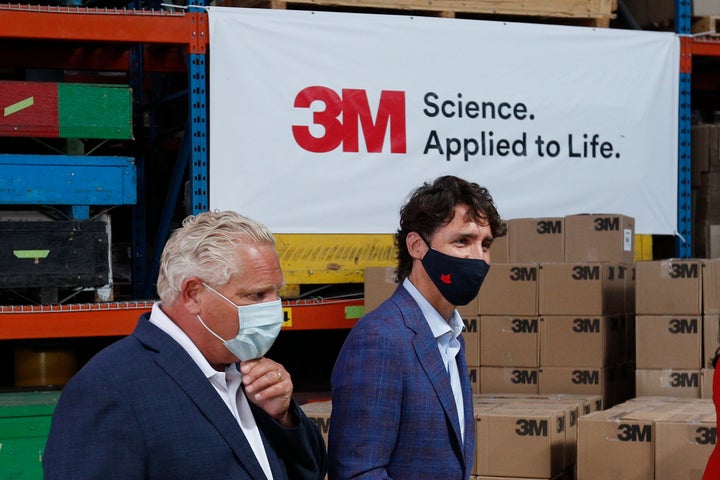 Ontario Premier Doug Ford and Prime Minister Justin Trudeau leave after an announcement at the 3M plant in Brockville, Ont. on Aug 21, 2020.