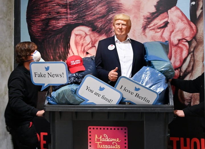 The wax figure of President Donald Trump is pushed in a garbage container at Madame Tussauds Berlin.