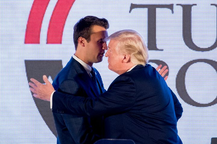 President Donald Trump shakes hands with Turning Point USA Founder Charlie Kirk on July 23, 2019, at a Turning Point USA Teen Student Action Summit in Washington. Kirk is among the right-wing activists who regularly appear on the Salem Radio Network channel The Answer.