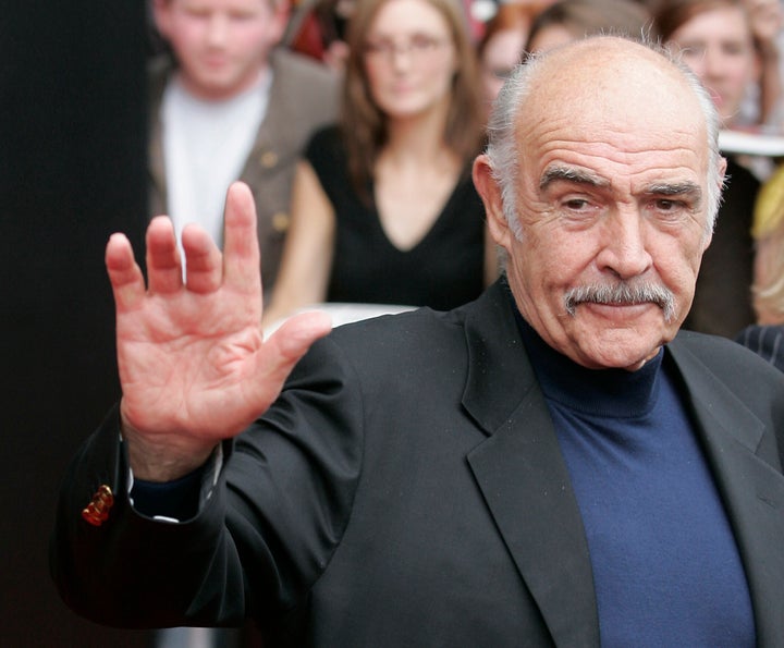 Sean Connery waves as he arrives to receive the Bafta Scotland Lifetime Achievement Award in Edinburgh, Scotland August 25, 2006.