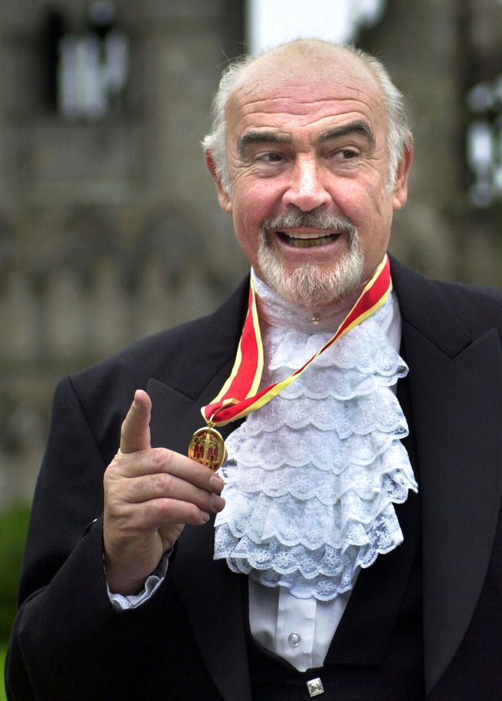 Sean Connery, donning full Highland dress and wearing his medal after he was formally knighted by the Queen during a investiture ceremony, at the Palace of Holyroodhouse in Edinburgh. 