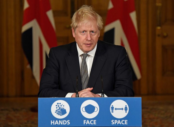 British Prime Minister Boris Johnson speaks during a press conference on Saturday, during which he announced new restrictions to help combat a coronavirus surge.