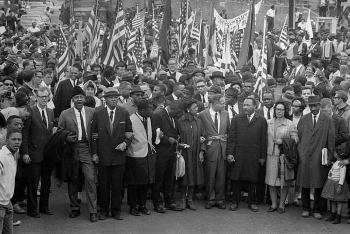 Dr. Martin Luther King leads an estimated 10,00 or more civil rights marchers out on the last leg of their Selma-to-Montgomery march.
