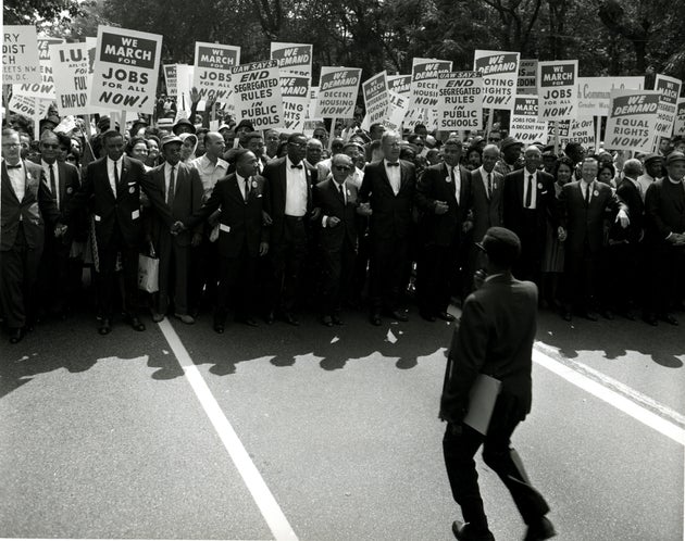 Civil Rights leaders holds hands as they march along the National Mall during the March on Washington...