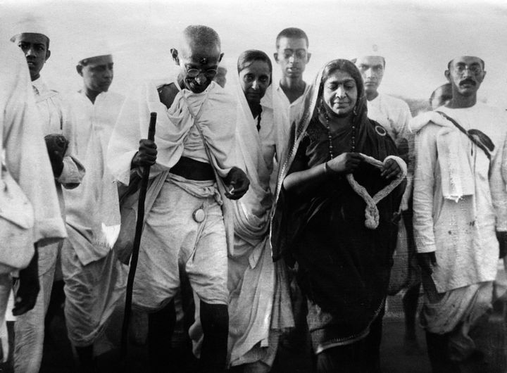 Mahatma Gandhi and Mrs Sarojini Naidu, poetess and politician, on their way to break the state laws at Dandi, India, on 24 April, 1930. 