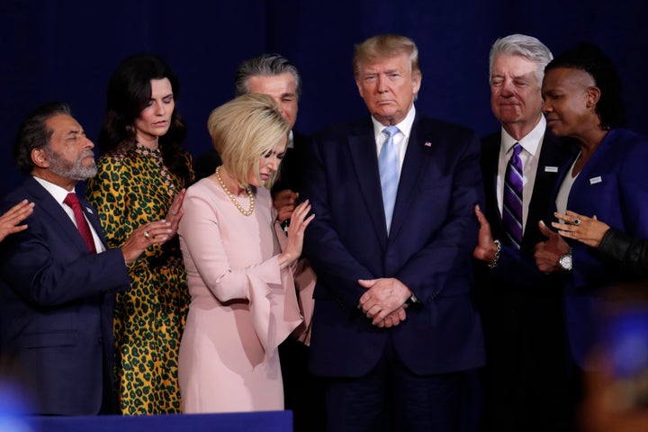 Faith leaders pray with President Donald Trump during a rally for evangelical supporters at the King Jesus International Ministry church in Miami in January 2020.