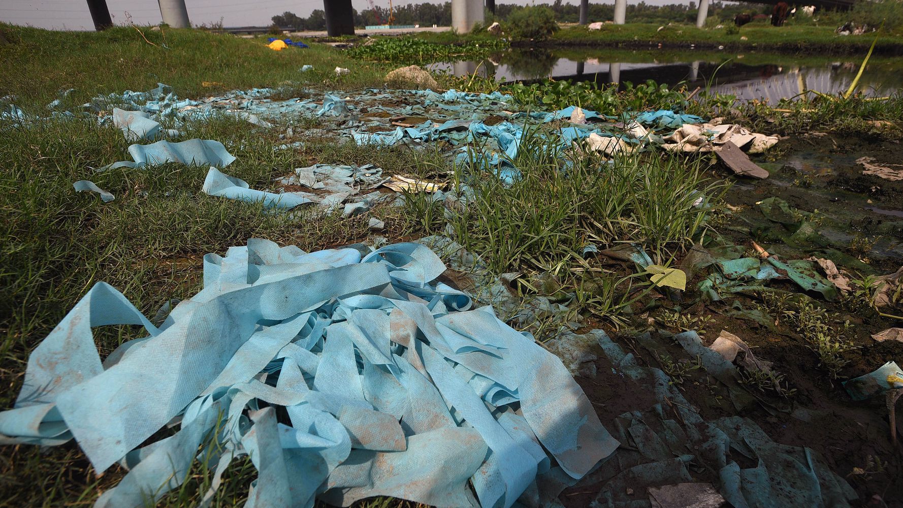 Plastic Masks, PPE, Biomedical Waste Choke Water Bodies In India - HuffPost